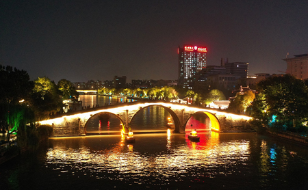 Nighttime view of ancient bridge on Grand Canal